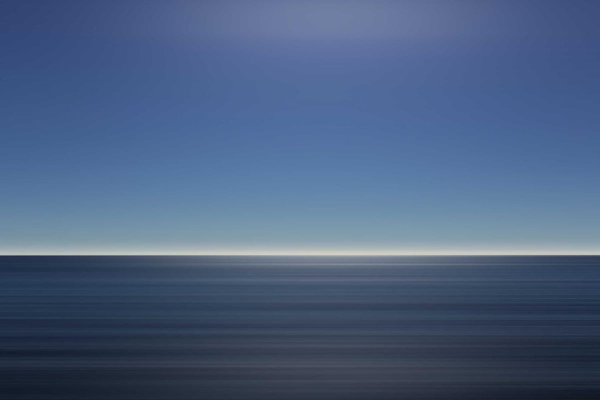 Bull mahi on the gaff alongside the boat