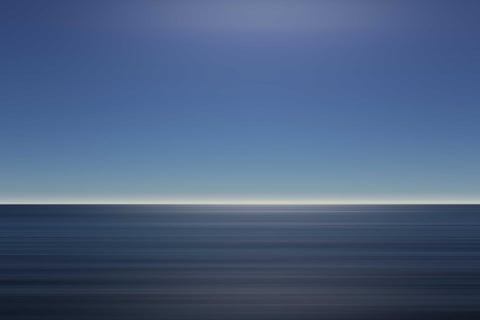 Bull mahi on the gaff alongside the boat